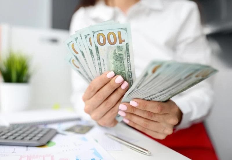 Female hands counting Lawsuit Loan cash