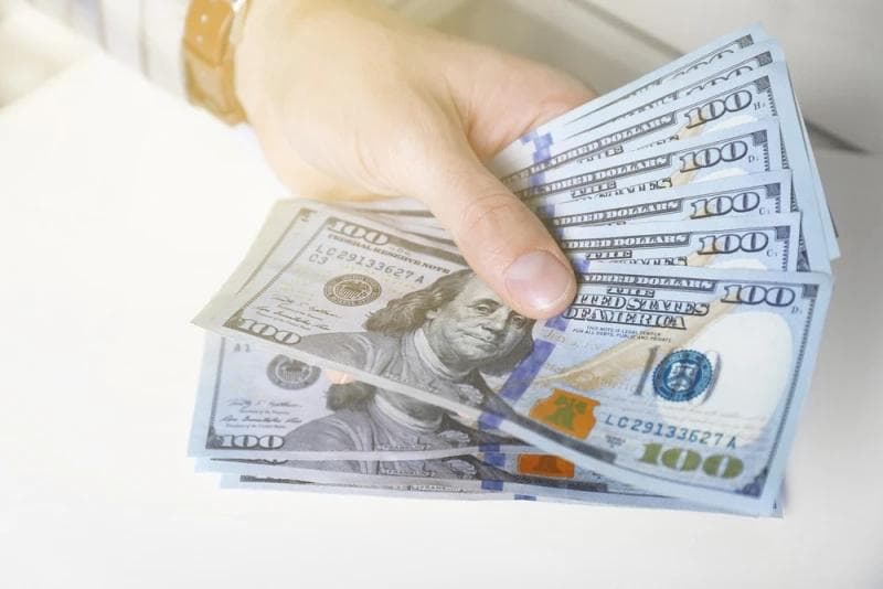 Man handing Legal Funding money