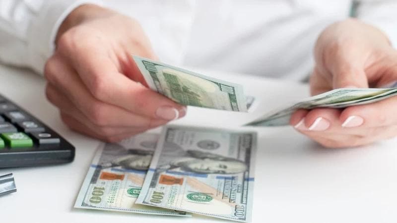 Female hands counting Lawsuit Loan cash