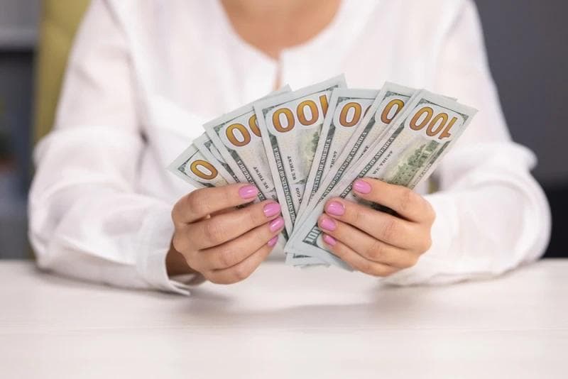 Woman counting Lawsuit Loan cash