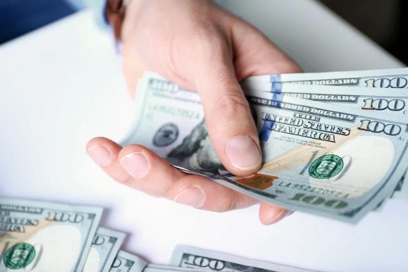 Man handing Legal Funding money