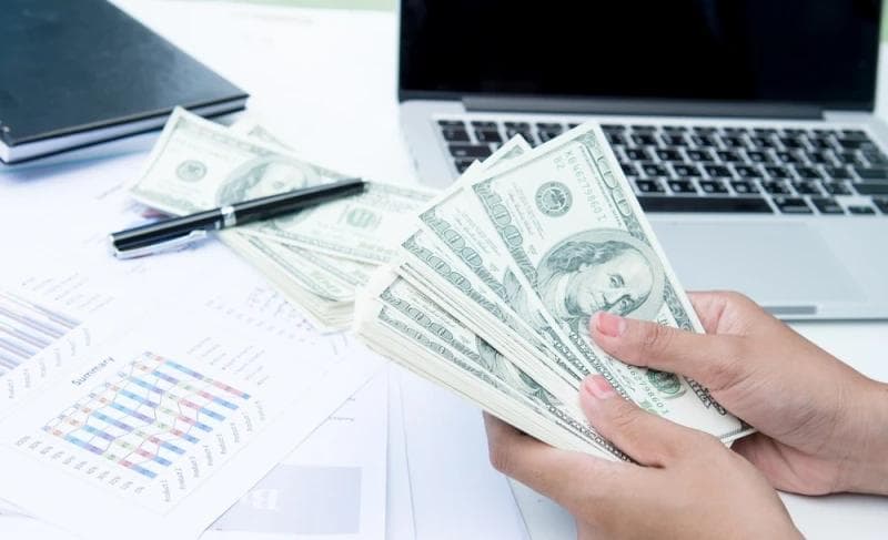 Woman counting Legal Funding money