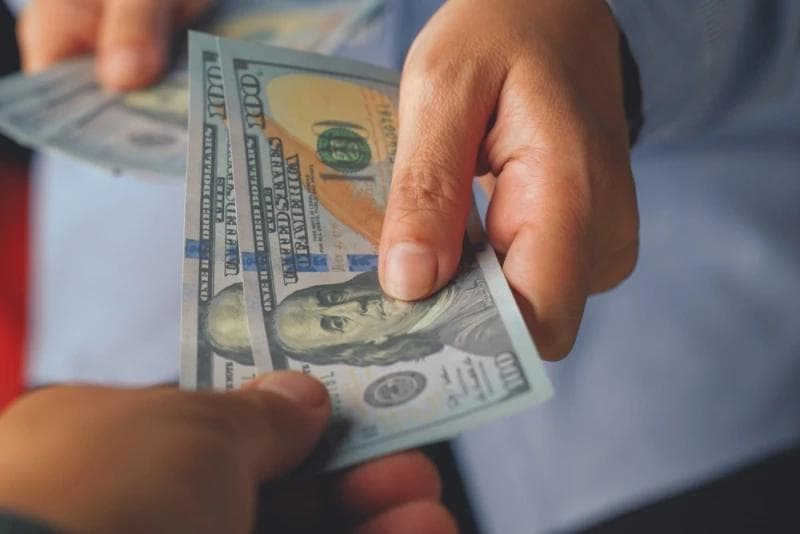 Man handing Lawsuit Cash Advance