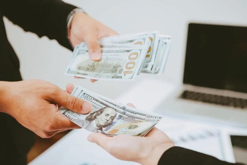 Man receiving post-settlement funding cash