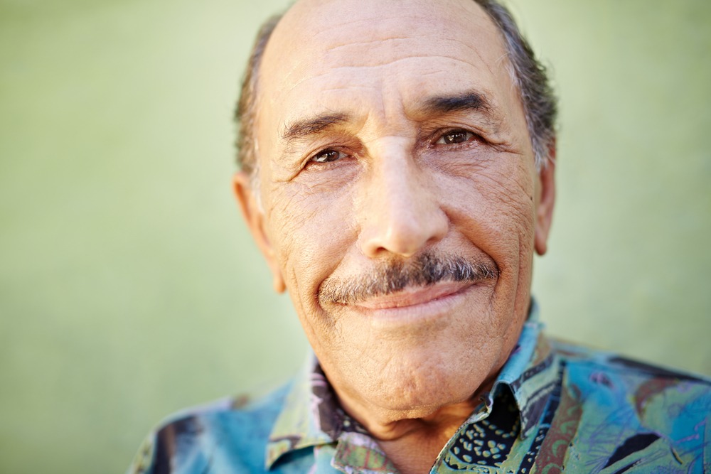 Portrait of a 60 year old latin man. He just received pre-settlement funding from Rockpoint.
