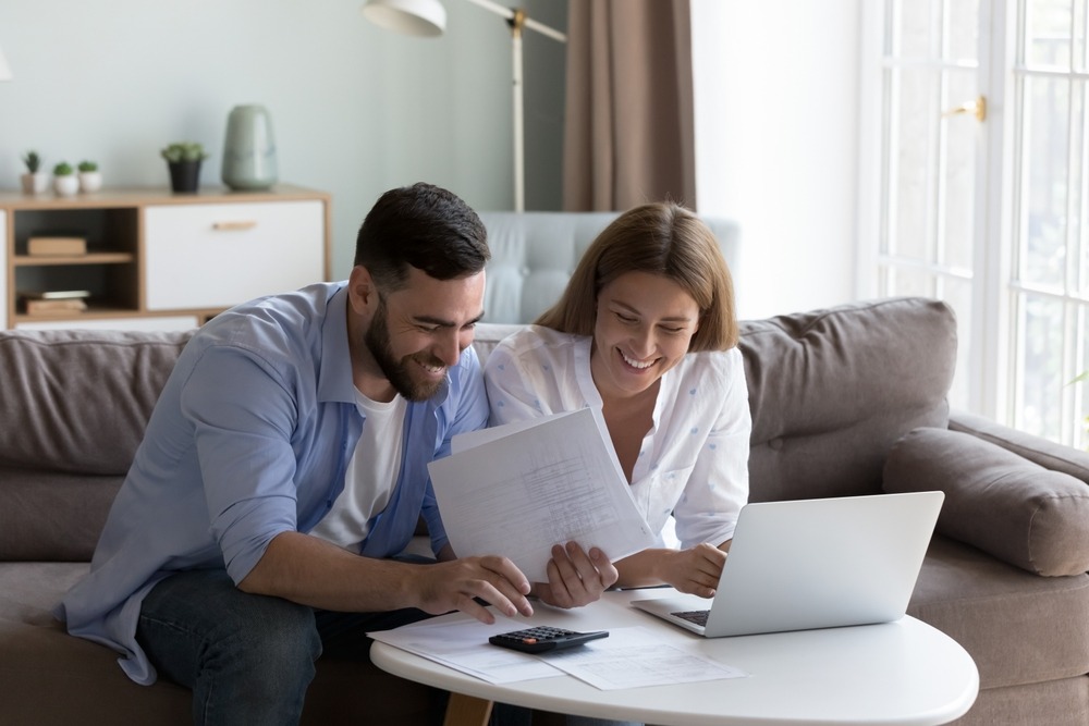 happy couple going over finances