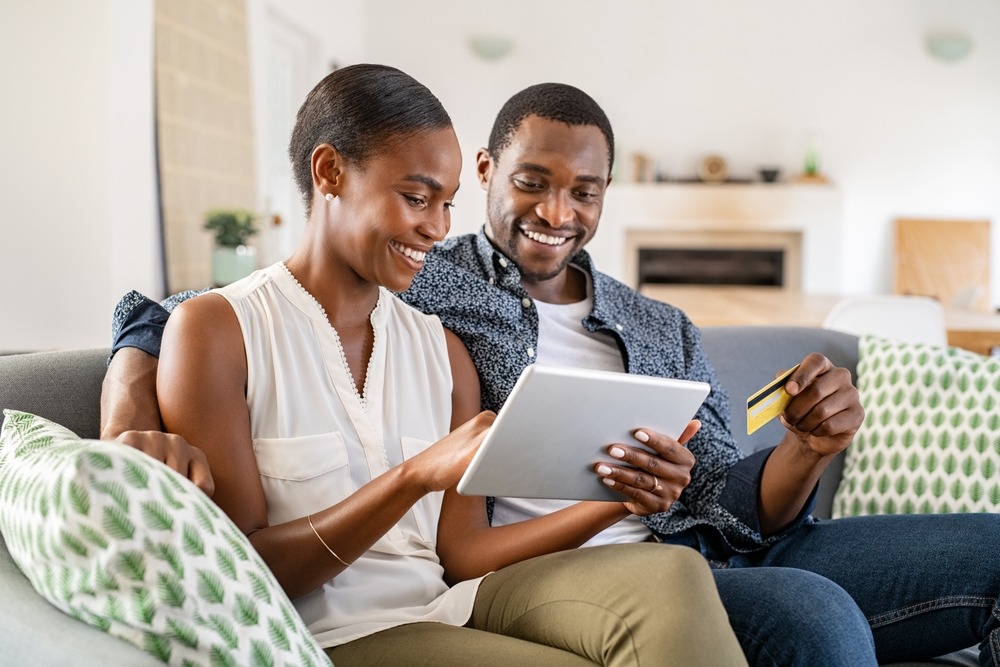 black woman doing her bills online