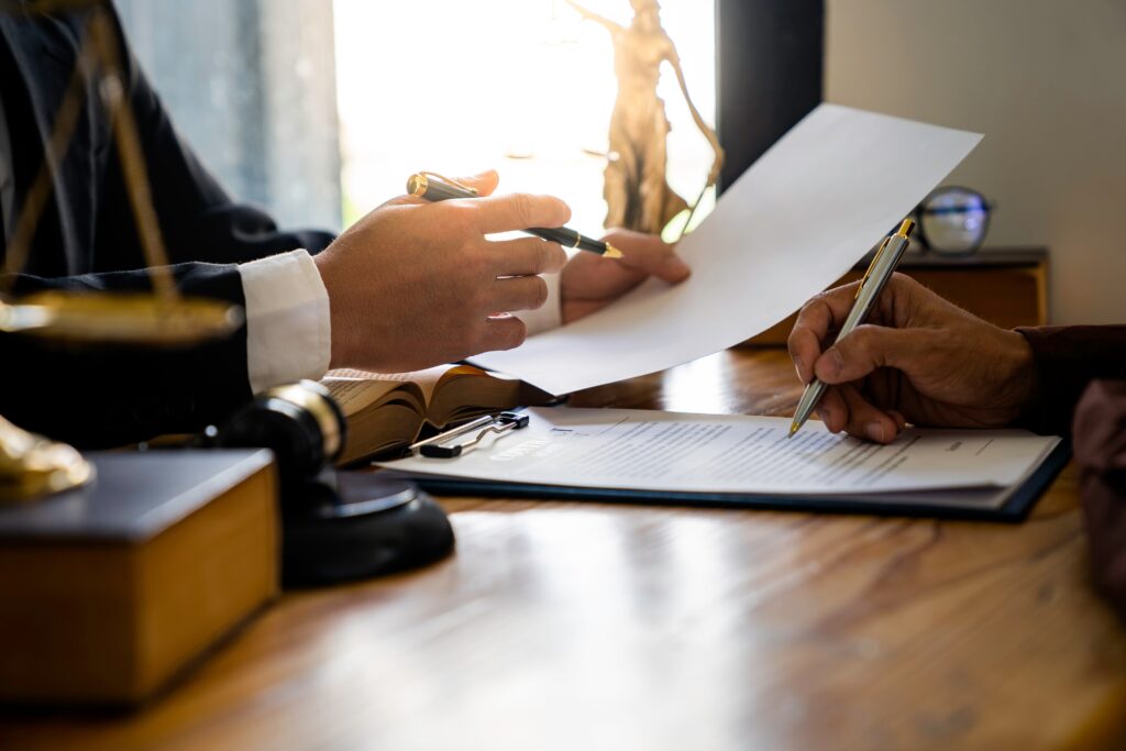 lawyer and client doing paperwork together